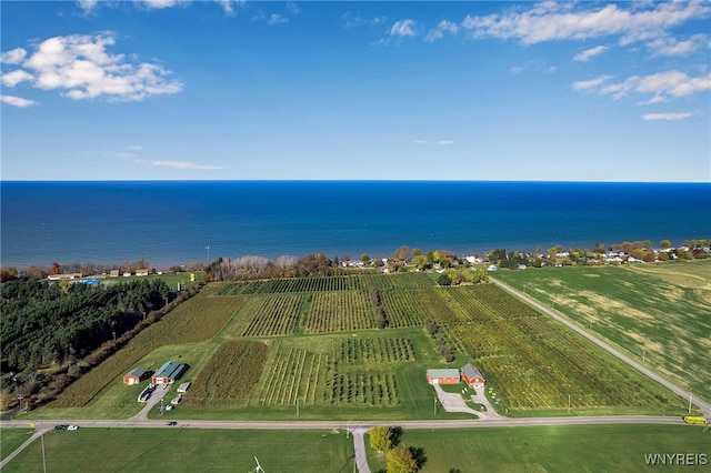 birds eye view of property featuring a water view and a rural view