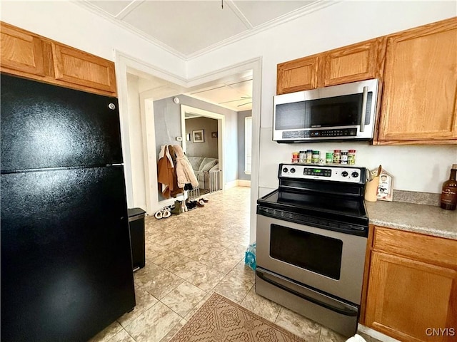 kitchen with brown cabinetry, ornamental molding, stainless steel appliances, and light countertops