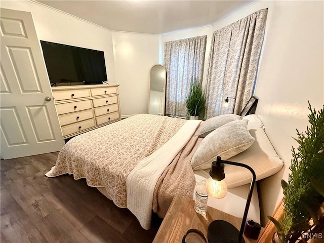 bedroom featuring wood finished floors