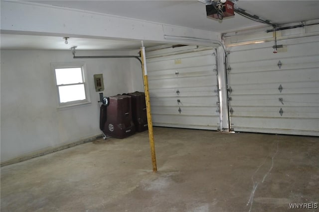 garage featuring electric panel and a garage door opener