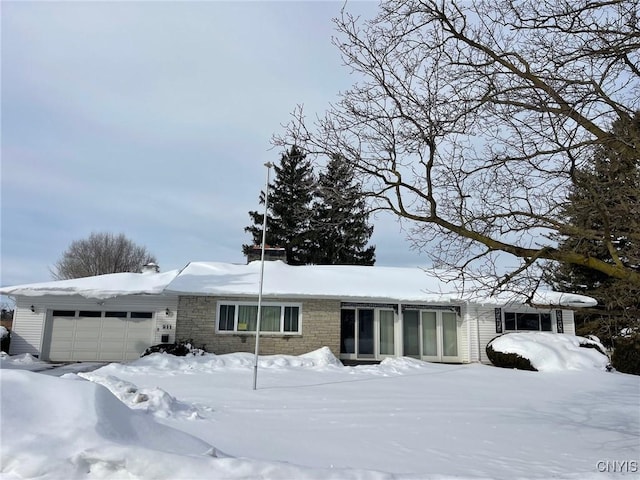 single story home featuring a garage