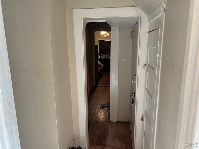 corridor with dark wood-style flooring