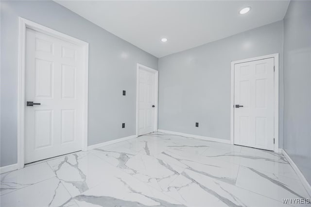 bedroom featuring marble finish floor, baseboards, and recessed lighting