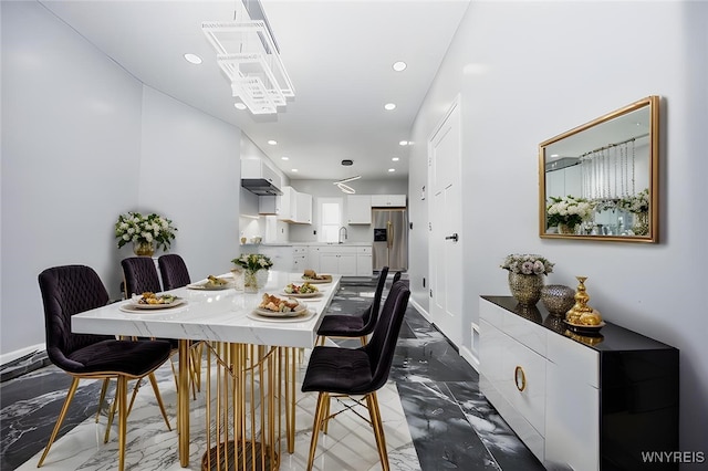 dining room with marble finish floor, baseboards, and recessed lighting