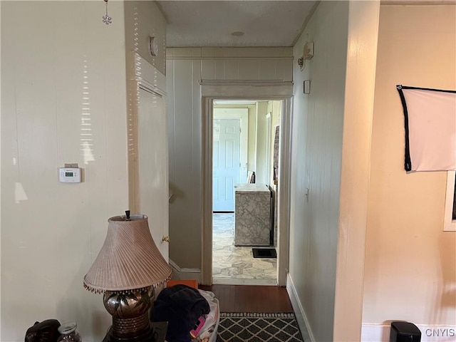 hallway with wood finished floors