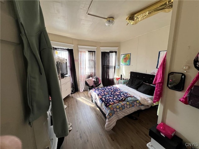 bedroom featuring wood finished floors