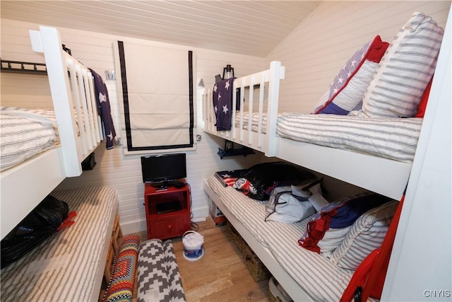 bedroom featuring vaulted ceiling and wood finished floors