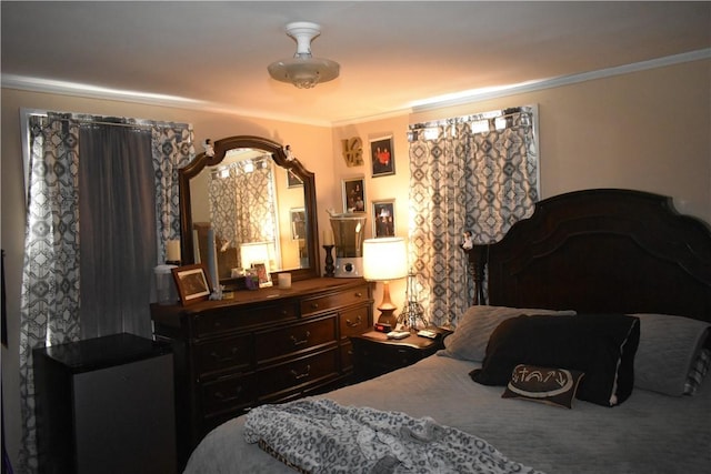 bedroom with ornamental molding