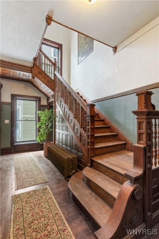 stairway with wood finished floors