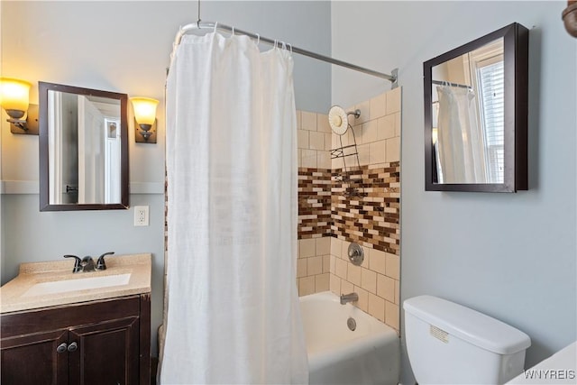 full bath with toilet, shower / bath combination with curtain, and vanity