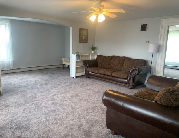 living room featuring a baseboard radiator, a ceiling fan, carpet floors, and a baseboard heating unit