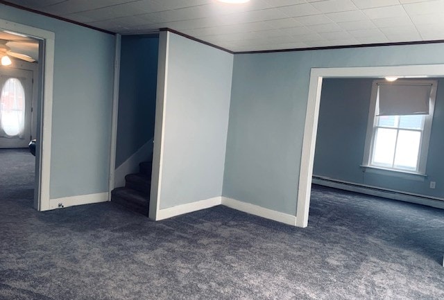 interior space featuring carpet floors, a healthy amount of sunlight, and baseboard heating