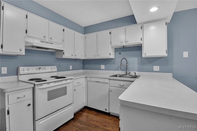 kitchen featuring white appliances, under cabinet range hood, white cabinets, and light countertops