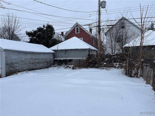 view of yard covered in snow