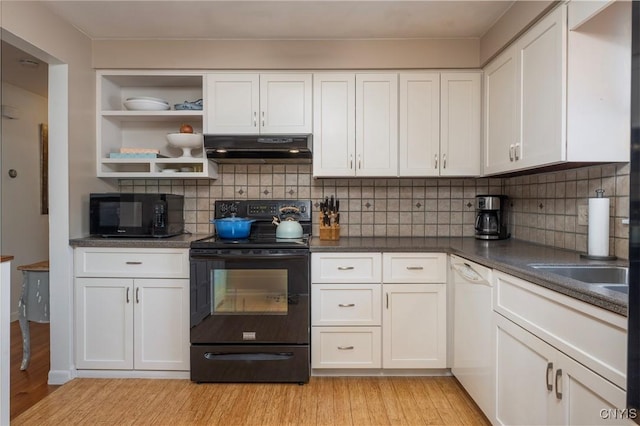 kitchen featuring light wood-type flooring, white cabinets, under cabinet range hood, and black appliances