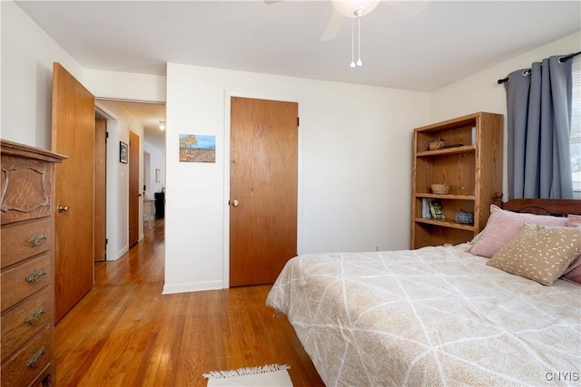 bedroom featuring light wood-style flooring and a ceiling fan