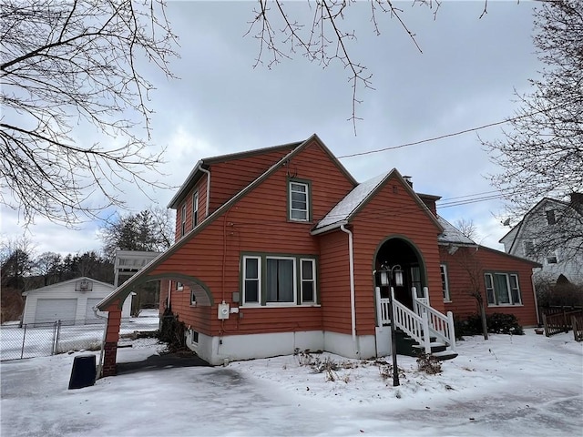 view of front of home with an outbuilding and a detached garage