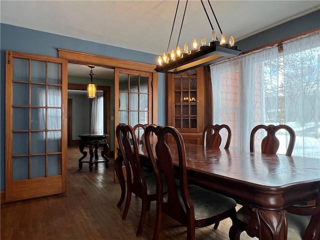 dining space with dark wood-style floors