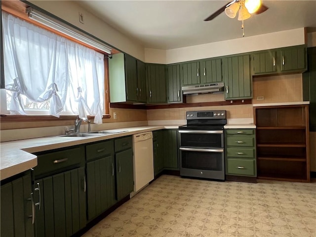 kitchen with white dishwasher, light countertops, under cabinet range hood, double oven range, and a sink