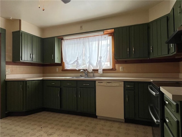 kitchen with range with two ovens, white dishwasher, a sink, light countertops, and light floors