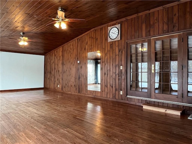 unfurnished living room with lofted ceiling, ceiling fan, wood ceiling, and wood finished floors