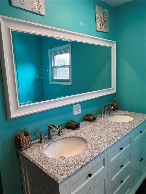 bathroom with double vanity and a sink