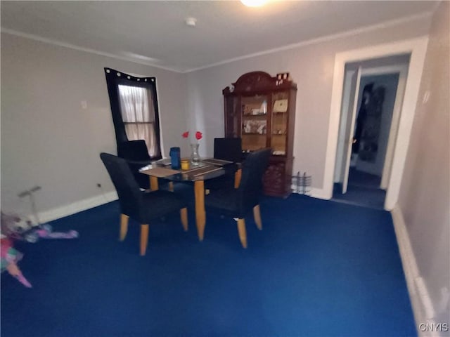 carpeted dining space with crown molding and baseboards