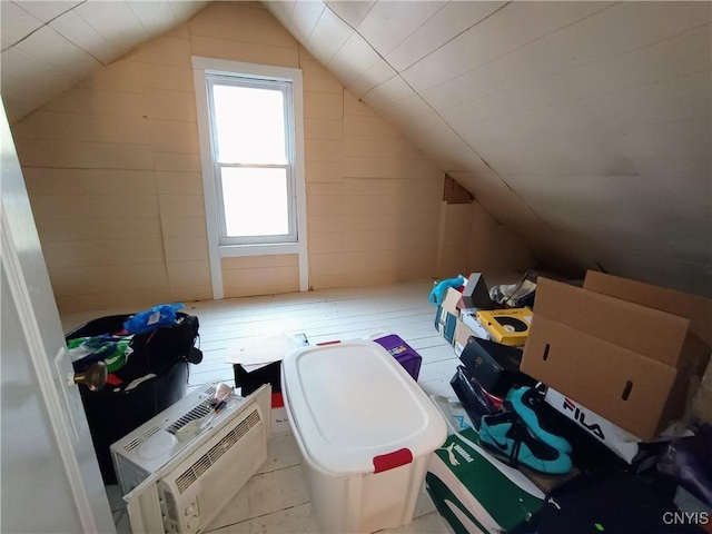 bonus room featuring vaulted ceiling and a wall mounted AC