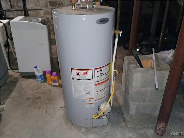 utility room featuring water heater