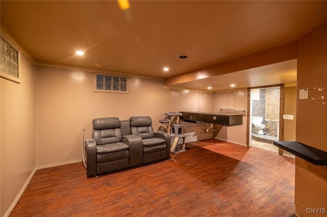 home theater with baseboards, wood finished floors, and recessed lighting