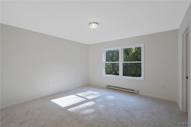 carpeted empty room featuring baseboards and a baseboard heating unit