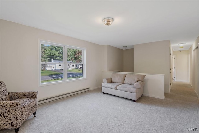 sitting room featuring carpet floors, baseboards, and baseboard heating