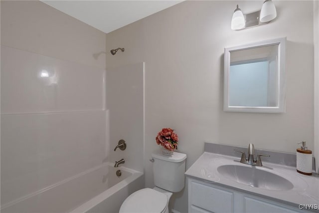 bathroom featuring toilet, tub / shower combination, and vanity