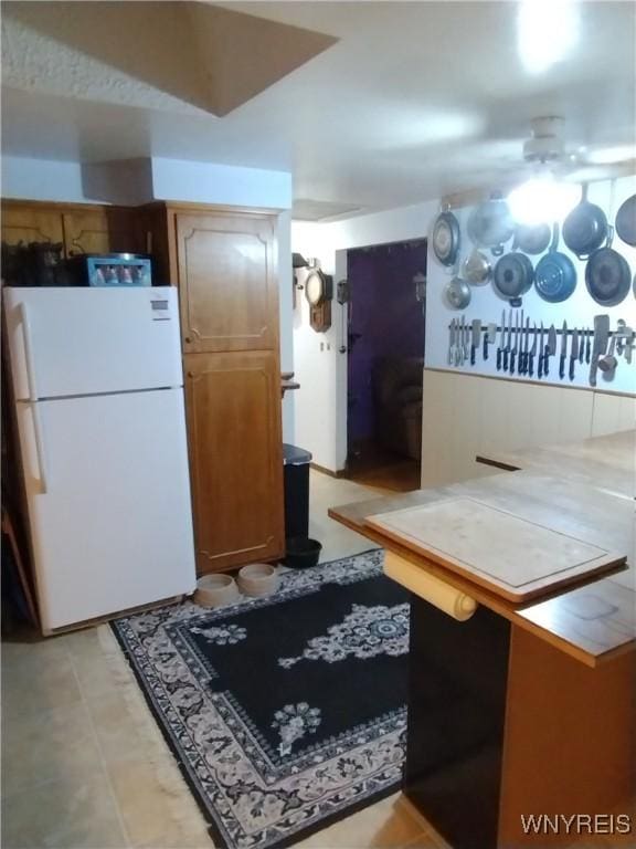 kitchen featuring freestanding refrigerator