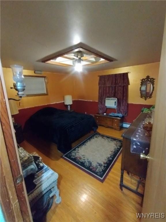 bedroom with wood finished floors