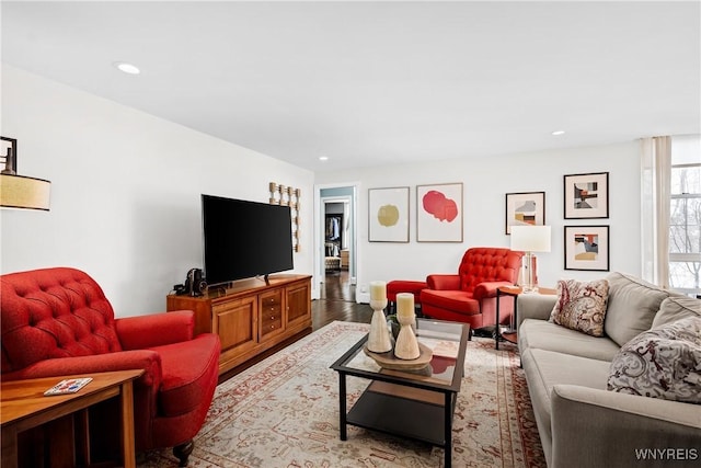 living area featuring wood finished floors and recessed lighting