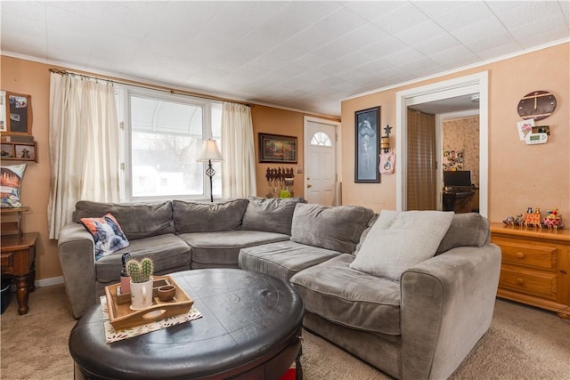 living area with ornamental molding, light colored carpet, and baseboards