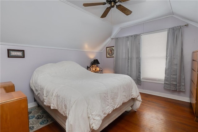 bedroom featuring a ceiling fan, lofted ceiling, dark wood finished floors, and baseboards