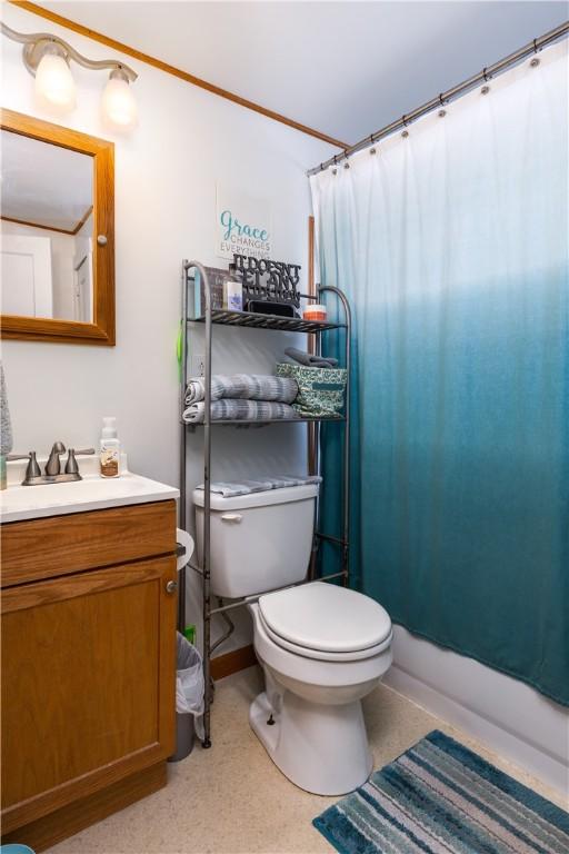 bathroom featuring toilet and vanity