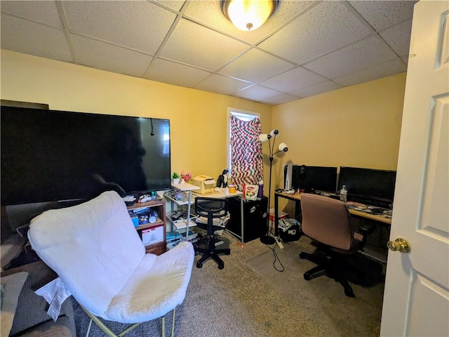 office space with carpet floors and a paneled ceiling