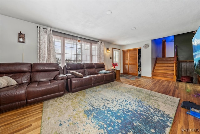 living room with light wood-style flooring and a wealth of natural light