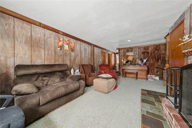 living area with wood walls and carpet flooring