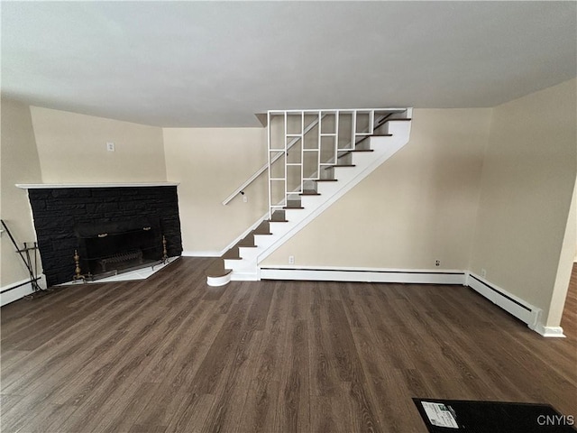 unfurnished living room with stairs, baseboards, a fireplace, and dark wood-type flooring