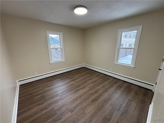 spare room with wood finished floors