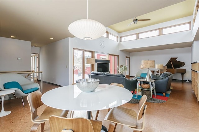 dining room featuring baseboards and recessed lighting