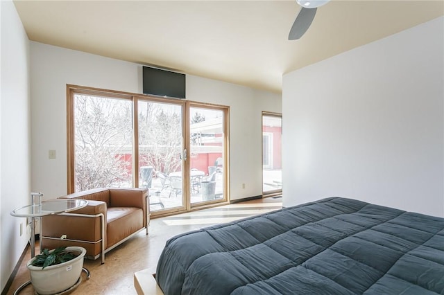 bedroom featuring access to exterior and a ceiling fan