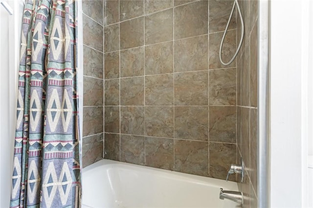 bathroom featuring shower / tub combo with curtain