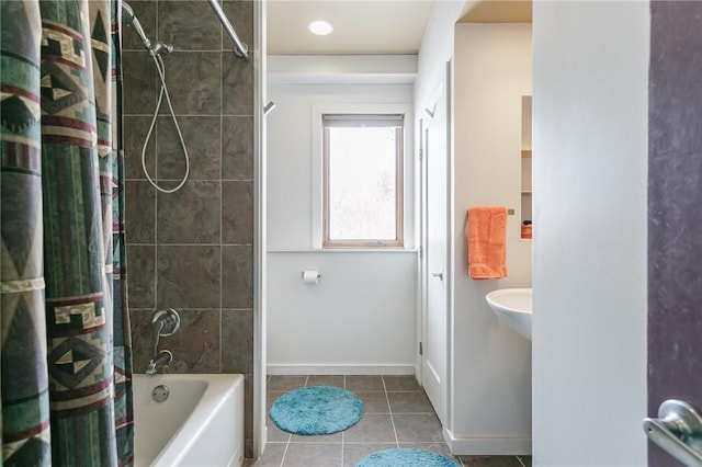 full bath featuring shower / bath combination with curtain, baseboards, and tile patterned floors