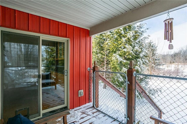 doorway to property featuring fence