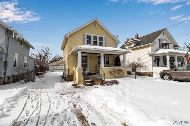 view of front of house featuring a garage and a porch